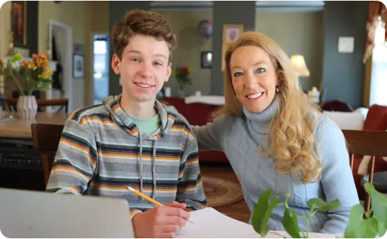 Mother and son working together at home