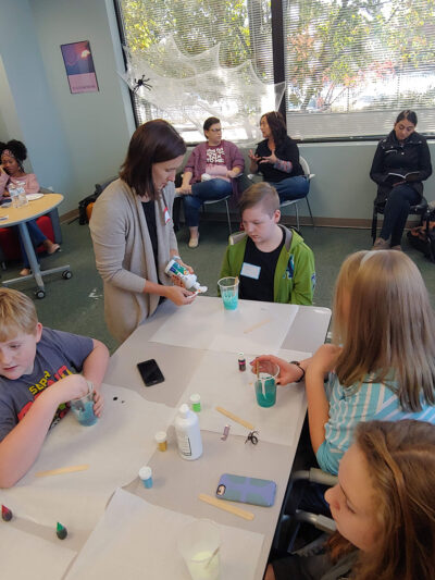 Students doing experiments in fall festival