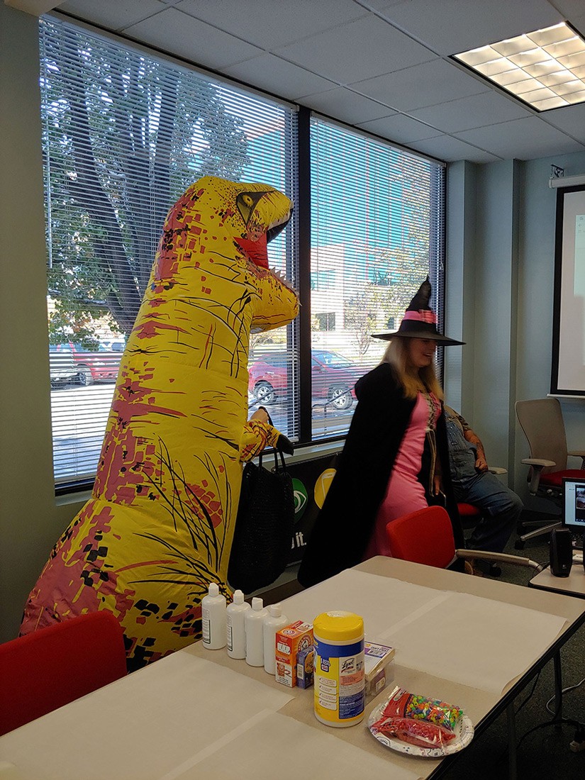big dinosaur costume having fun at the festival