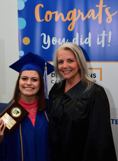 graduated student with teacher