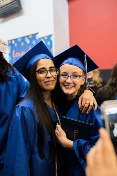 Happy girl students graduating