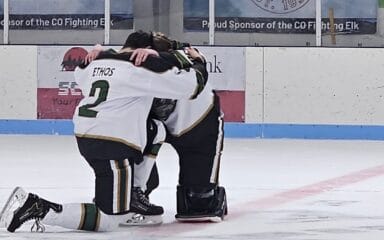 hockey players huddled around each other